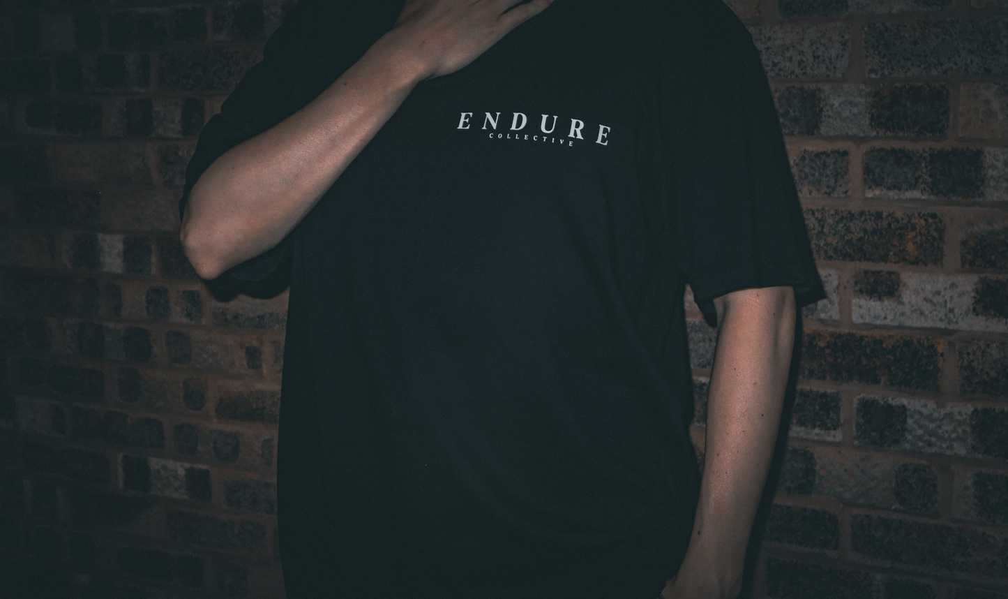 Minimal ENDURE COLLECTIVE front logo on oversized T-shirt