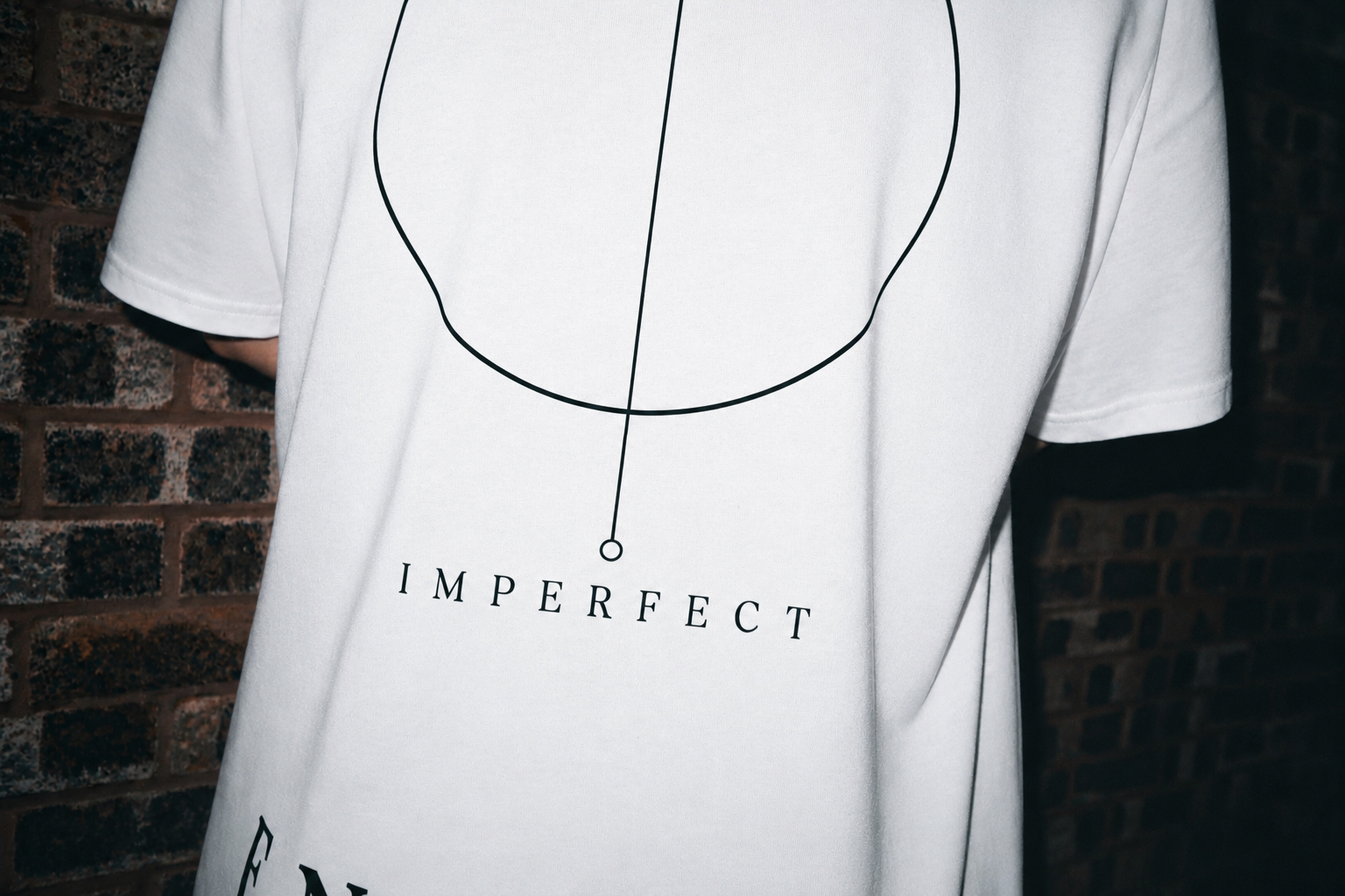 White Imperfect Circle oversized T-shirt back graphic detail with symbolic circle print by ENDURE COLLECTIVE
